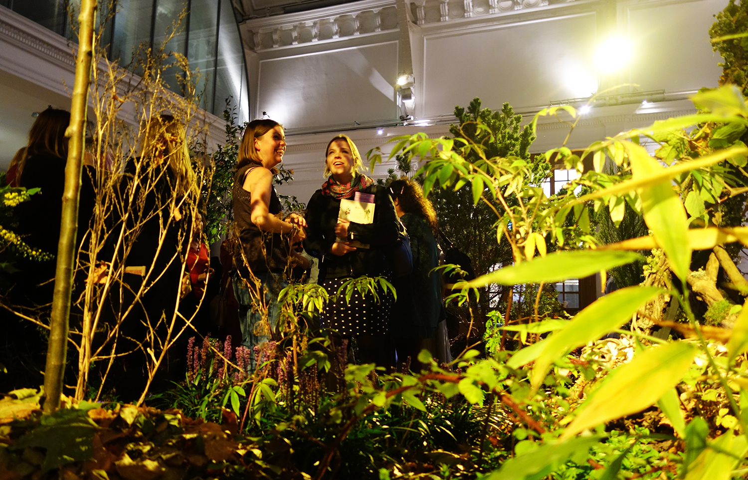 Visitors in conversation among the layered planting
